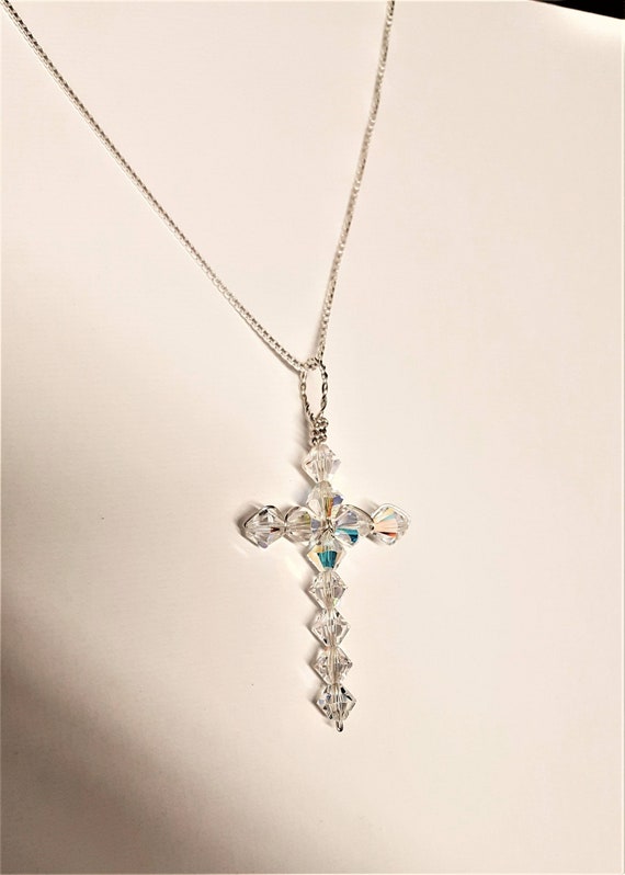 SwarovskiInsigne family necklace with a cross of 6 clear crystals