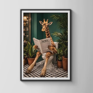 May include: A framed wall art print featuring a giraffe wearing round black glasses whilst sitting on a white toilet and reading a newspaper with the word News printed on the front page. The scene is set against a dark green wall with potted plants.