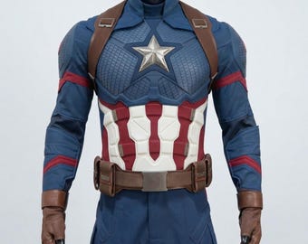 May include: A blue, red, and white tactical costume featuring a textured chest plate with a central silver star emblem. The outfit includes brown leather-like shoulder straps, a matching utility belt, and fingerless brown gloves on long sleeves.