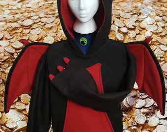 May include: Black and red dragon-themed hoodie with a hood featuring red horns and a red interior. The hoodie has red wings attached to the sleeves and a red pocket. The design includes a blue collar with a green emblem.