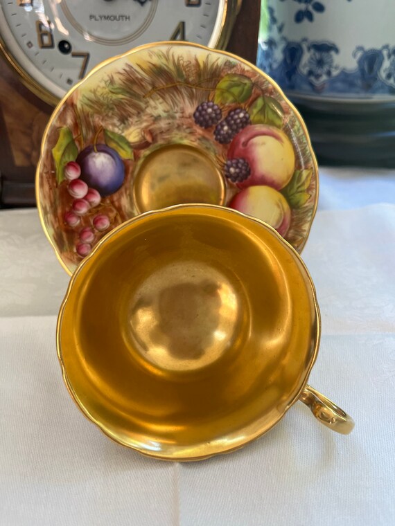 Aynsley Orchard Gold Teacup and Saucer Set: Signed D. Jones & N