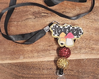 Interchangeable Badge Reel with lanyard- includes what is shown and a 2nd mystery badge reel