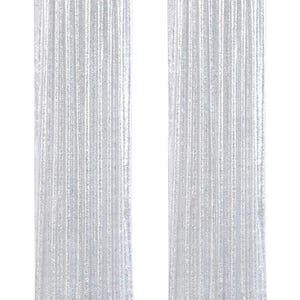 May include: Two floor-length curtains made of shimmering silver sequins. Each panel features a dense, reflective surface that catches light, hanging vertically from a black rod with a gathered top header that creates uniform, straight pleats.