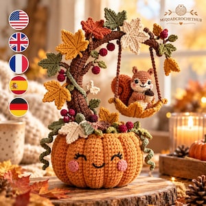 May include: A crocheted orange pumpkin with a smiling face serves as a base for a curved brown branch. The branch holds a hanging leaf swing with a small brown squirrel holding an acorn. The display is decorated with colourful autumn leaves and berries.