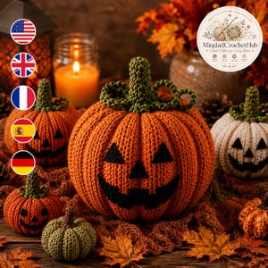 May include: A collection of crocheted pumpkins in orange, white, and green, featuring black stitched jack-o'-lantern faces. The pumpkins have textured ribbed surfaces and green crocheted stems, arranged with autumn leaves and a glowing candle.