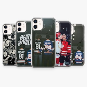 May include: Five clear phone cases featuring hockey-themed graphics. Designs include a black and white photo collage, the text HEATER RIVALS, and images of hockey players wearing jerseys with the names ROZANOV 81 and HOLLANDER 24 on the back.
