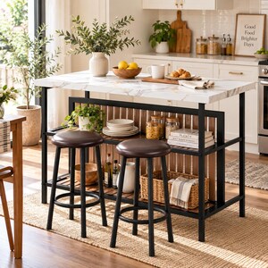 May include: A kitchen island with a white faux marble top and a black metal frame, featuring two round stools with dark brown padded seats. The island includes open shelving with wooden slats, holding stacked plates, glass jars, and a woven basket.