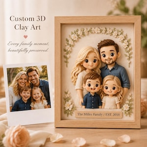 May include: A framed 3D clay art piece featuring a sculpted family of four, including two adults and two children, arranged under a floral arch. A rectangular plaque at the base reads The Miller Family / EST. 2018. A photo print shows the same family.