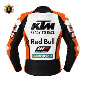May include: A motorcycle racing jacket in white, orange, and black. The back features the KTM logo, the text READY TO RACE, Red Bull, WP SUSPENSION, and MOTOREX. The sleeves display the number 68 and Red Bull logos. The jacket has ribbed panels.