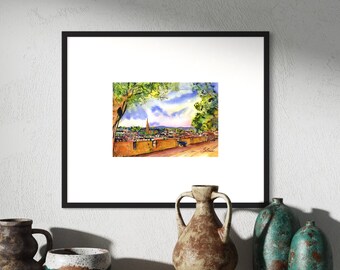 May include: A watercolour painting of a cityscape with a church spire in the distance. The painting is framed in a black frame and is hanging on a wall. There are several decorative vases on a wooden shelf below the painting.