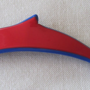Vintage red celuloid dauphin brooch