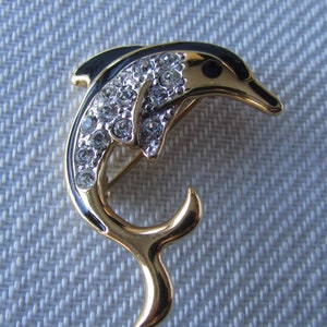 Vintage black enamel dauphin brooch with rhinestones