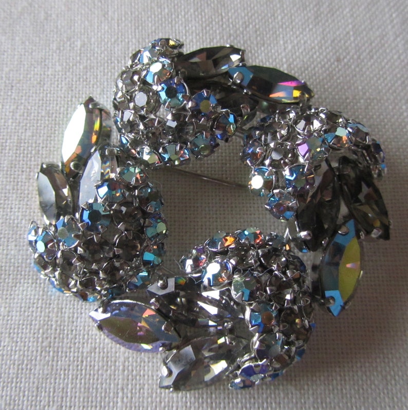 Vintage silver tone brooch with grey rhinestones