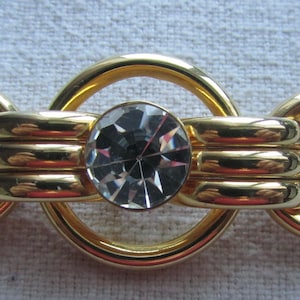 Vintage gold tone modernist brooch with rhinestones
