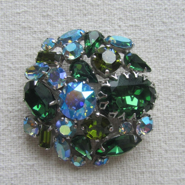 Vintage silver tone signed Sherman brooch with green rhinestones