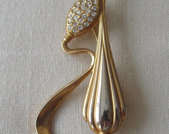 Vintage goudkleurige slangenbezweerder fluit broche met strass steentjes