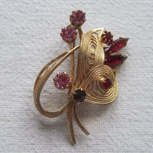 Vintage gold tone red and pink rhinestones bouquet brooch