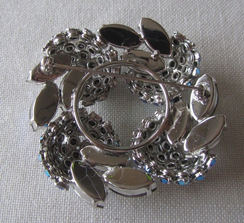 Vintage silver tone brooch with grey rhinestones
