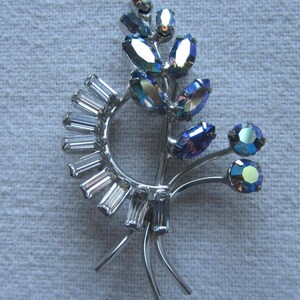 Vintage silver tone blue and clear rhinestones bouquet brooch