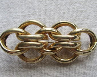 Vintage gold tone modernist knot brooch