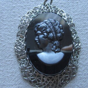 Vintage silver tone filigree black cameo pendant