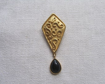 Vintage gold tone modernist black cabochon brooch