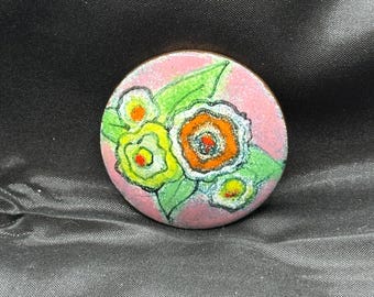 Floral Themed Circular Enamel Brooch, Signed, Cabrini, 1.5” in Diameter, Pinks, Green, Yellow, Red, Orange