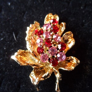 Sparkling Red and Pink Rhinestones on Gold Tone Pin on Leaf