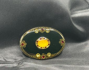 Catherine Popesco Oval Enamel Brooch, Black with Gold Details with Red and Yellow Rhinestones, Trombone Latch, 1 7/8” x 1.25”