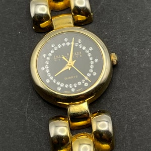Joan Rivers Classics Gold Tone Wrist Watch, Black Face, Clear Rhinestones, Seconds Hand, New Battery, Works Fine, Japan Movement