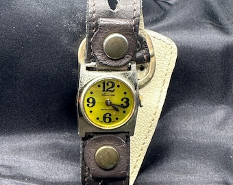 Lucerne Mechanical Watch, Wind Up, Yellow Green Face, Swiss Made, Works Fine, Face is  .75” in Diameter, Band Shows Severe Wear