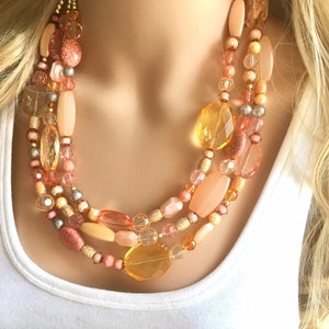 Peach Chunky Statement Necklace & Stretch Bracelet set, Triple Strand Beaded Jewelry, coral pink jewelry, peach bridesmaid marigold gold