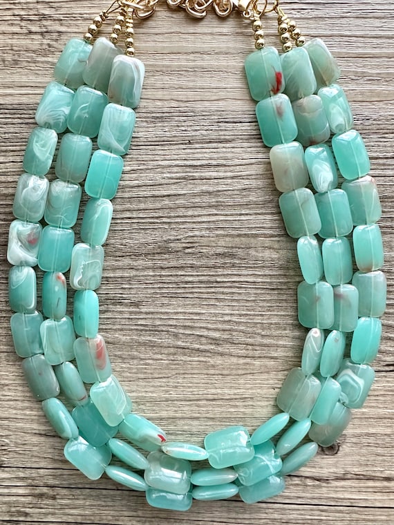 Collana statement con perle di legno verde safari | Paris Fashion Shops