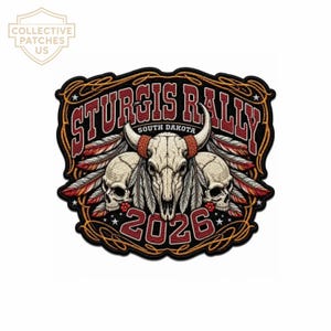 May include: An embroidered patch featuring a central bull skull flanked by two human skulls, with feathers and the text STURGIS RALLY SOUTH DAKOTA 2026. The design uses red, white, and black colors with a gold rope-style border on a black background.