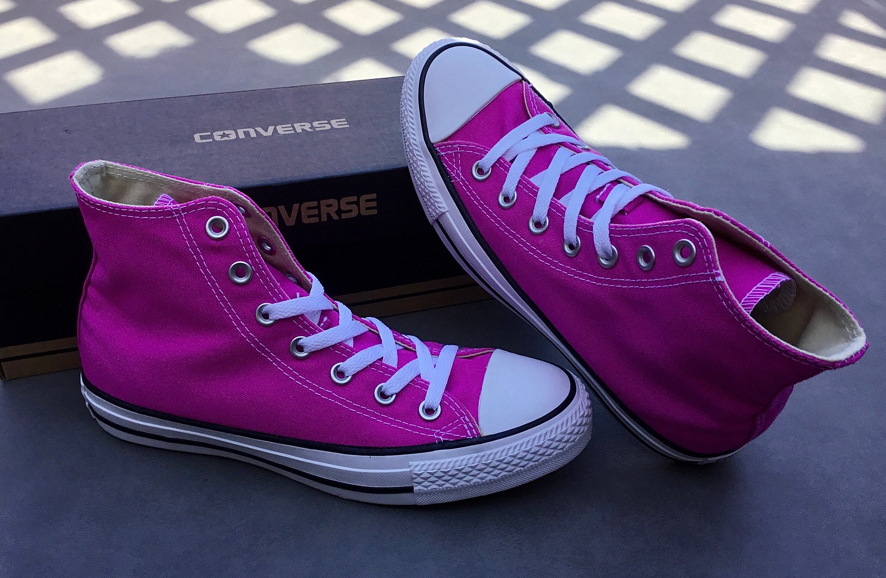 magenta high top converse