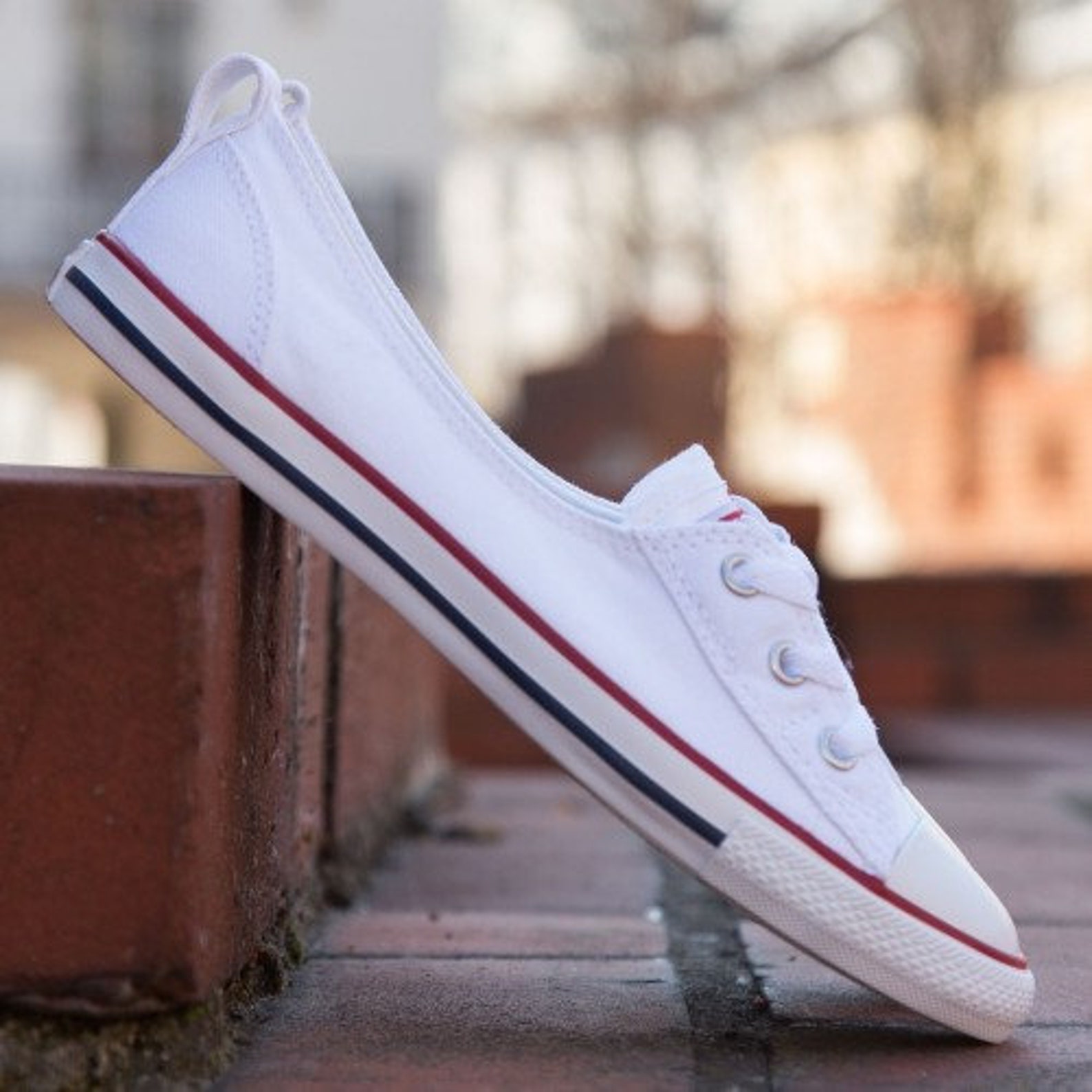 white chuck taylor slip ons