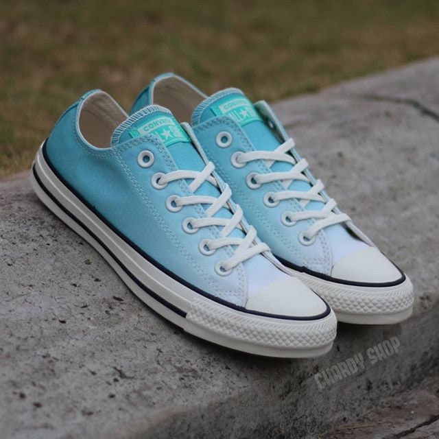 teal colored converse shoes