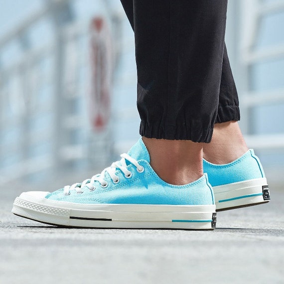 turquoise low top converse