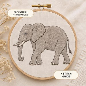May include: A round wooden embroidery hoop containing a light-colored fabric with a detailed grey thread-stitched elephant design. The hoop features a metal tension screw at the top. Text on the image reads: PDF PATTERN +4 HOOP SIZES and + STITCH GUIDE.