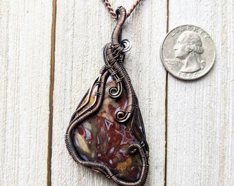 Indonesian palm root agate copper wire wrapped pendant