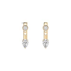 May include: A pair of gold earrings featuring a vertical bar design with a round brilliant-cut stone at the top and a pear-shaped stone at the bottom. The metal bar includes two circular cutouts between the stones. The text BLACKZARROS is visible.