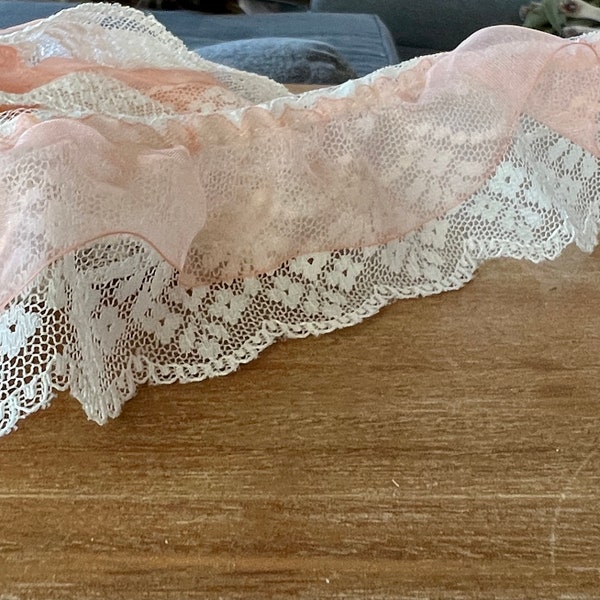 Layered Ruffled Lace 2 yds of Double Layered Ruffled Lace, topped by a sheer Peach Trim material.