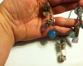 Crowned Treasure Necklace with a beach in a bottle