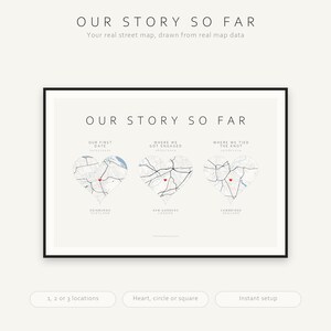 May include: A framed horizontal print titled OUR STORY SO FAR featuring three heart-shaped street maps. Each map includes a small red heart icon marking a specific location, with text labels for Our First Date, Where We Got Engaged, and Where We Tied The Knot.