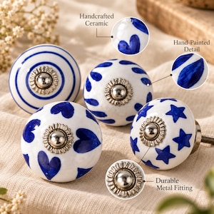 May include: Four round ceramic cabinet knobs featuring white surfaces with blue patterns including stripes, hearts, and stars. Each knob has a central silver-toned metal fitting with a scalloped edge and a threaded bolt extending from the back.