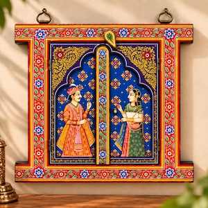 May include: A rectangular wooden wall hanging shaped like a window frame with two doors. The frame is painted red with blue and white floral patterns. The centre features a blue panel with a painted illustration of two figures in traditional attire.