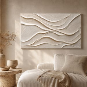 May include: A rectangular wall art piece featuring a cream-colored surface with raised, horizontal, wave-like textures. The artwork displays thick, layered paint strokes that create a three-dimensional effect across the entire canvas surface.