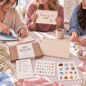 May include: A DIY pouch kit featuring a rectangular beige canvas pouch with a gold zipper, a brown cardboard box labeled DIY Pouch Kit, an instruction card, and two sheets of colorful adhesive patches including alphabet letters and various icons.