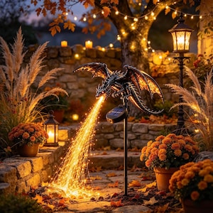 May include: A black dragon garden stake featuring solar-powered LED lights that emit a warm glow from its mouth, resembling a stream of fire. The dragon is mounted on a thin black pole with a small solar panel attached to the top section.