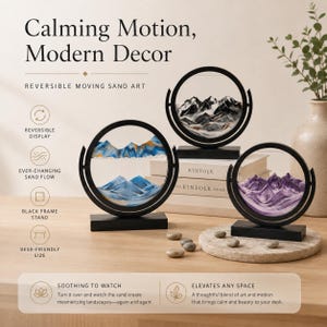 May include: Three circular moving sand art displays with black frames and rectangular bases. Each piece contains colored sand forming mountain landscapes in blue, black, and purple. Text on the image reads Calming Motion, Modern Decor, Reversible Moving Sand Art, Soothing to Watch, and Elevates Any Space.